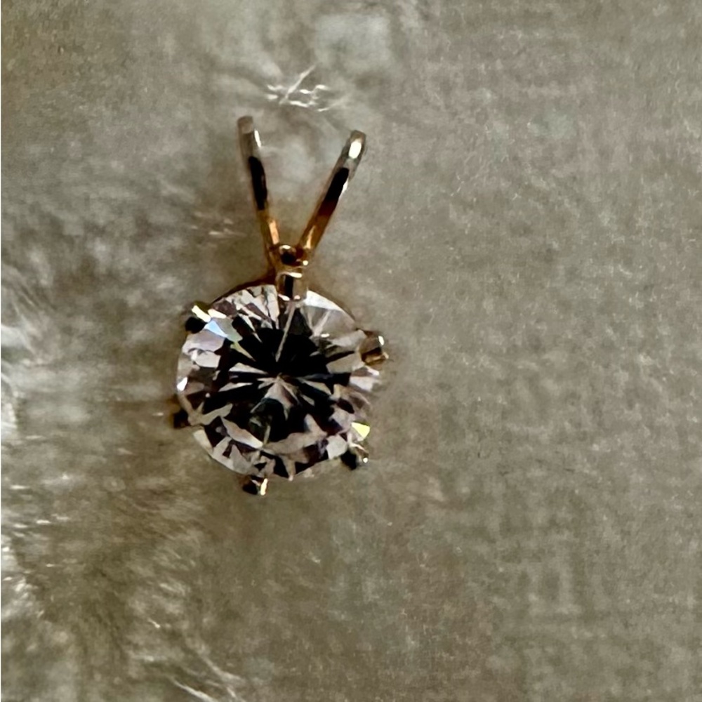 Elegant Gold and clear gemstone charm/pendant